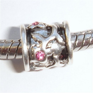 Cylinder with 4 flowers with pink zirconia in the center