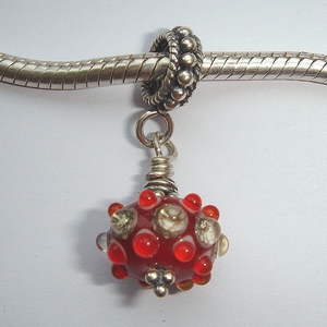 Red with silvered ivory and red dots