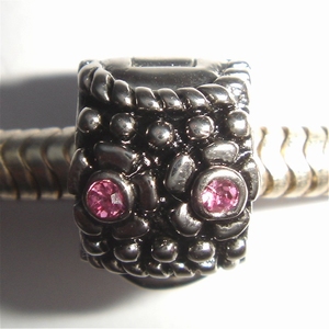 Clip with dots and pink zirconia's