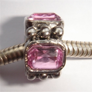 Cylinder with big pink zirconia's and dots