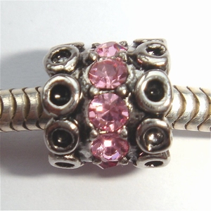 Cylinder with 2 rows of circles and pink zirconia's