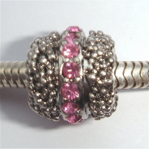 Barrel with dots and pink zirconia's in the middle