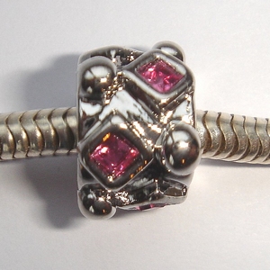 Cylinder with pink square zirconia's and dots
