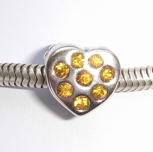 Heart with flower and amber zirconia's
