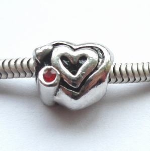 Heart on heart with red zirconia