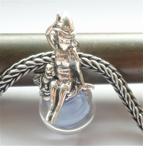 Witch on blue glass bead