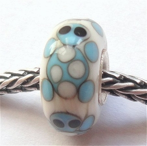 Four turquoise turtles on ivory