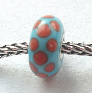 Turquoise with orange spots