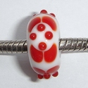 White with red circles and white dots 