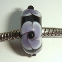 Zwart met paarse draaiingen en zwart stipje 