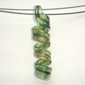 Glass pendant in in green with gold and brown-red 