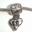 Pendant with heart on wich 2 feet 