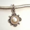Sterling silver pendant with soft pink pearl and bows 