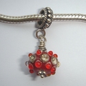 Red with silvered ivory and red dots 