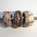 Ivory, purple and beige. 3 beads 