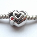Heart on heart with red zirconia 