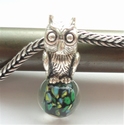 Owl on green glass bead 