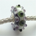 Ivory with green, purple and black dots 