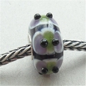 Green and purple spots with black dots 