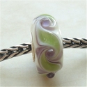 Ivory with green, purple, turnings and transparant dots 